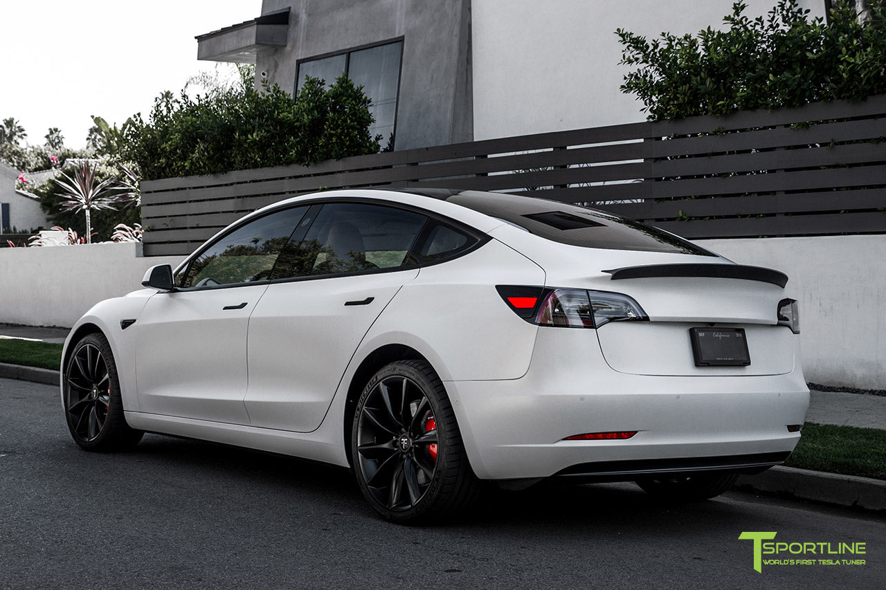Xpel Stealth Paint Protection Film Pearl White Tesla Model 3 with Matte Carbon Fiber Trunk Wing and Matte Black 20 inch TST Turbine Style Wheels by T Sportline