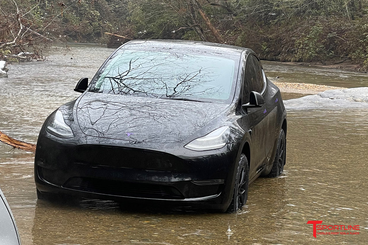 Black Tesla Model Y with 18" TSR Wheels and All Terrain Tires