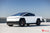Satin White Tesla Cybertruck with 22" CT7 Tesla Cybertruck Aftermarket Wheels in Satin Black and Reupholstered Ferrari Black Interior Door Insert and Upper Dash by T Sportline